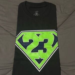 Black and green shirt that matches doernbecher Jordan 4